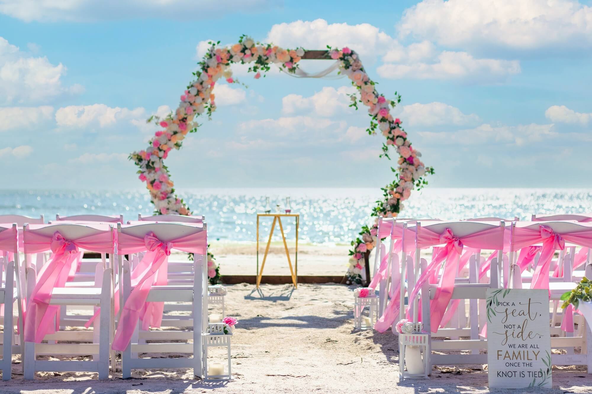 Fresh-flower beach wedding ceremony at golden hour on Florida's Gulf Coast