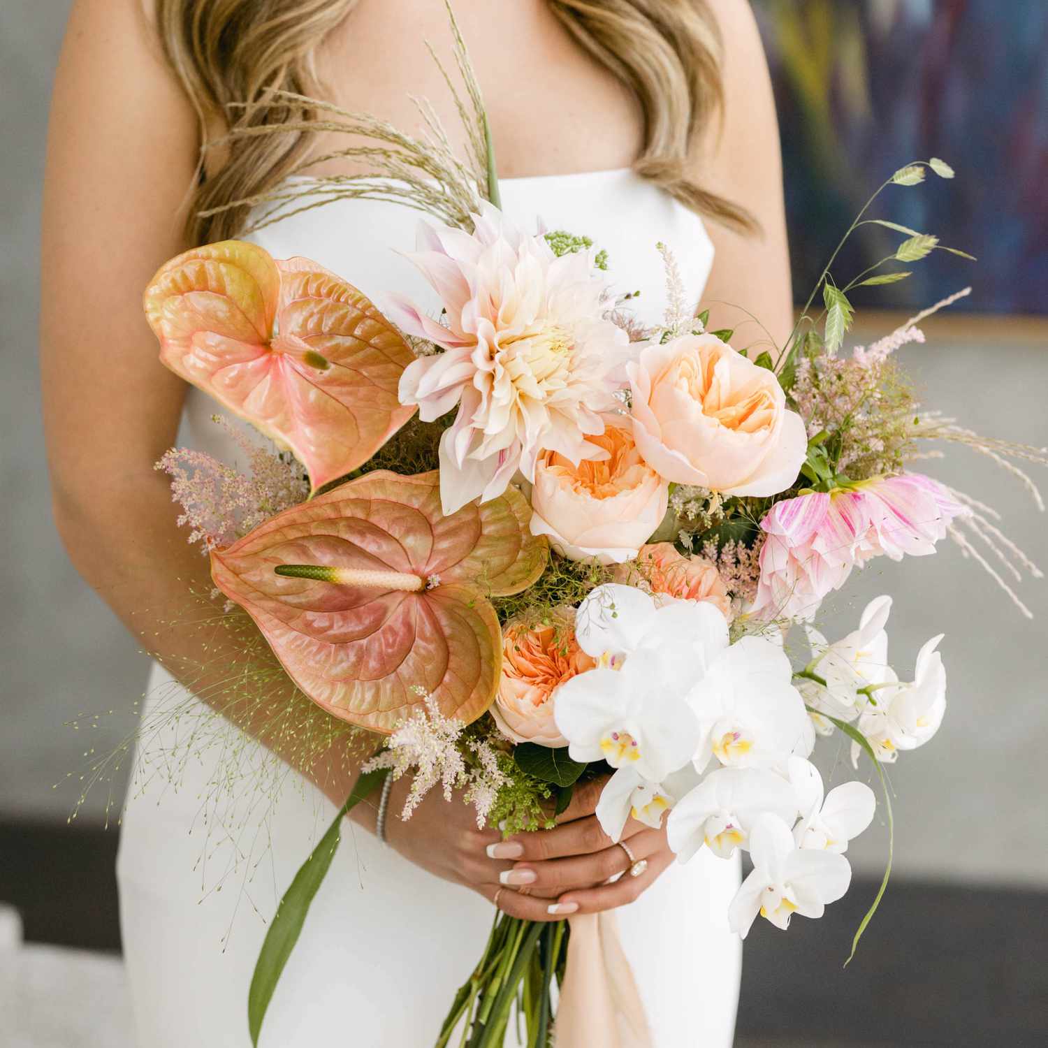 Fresh floral ceremony details on the white quartz sand of Siesta Key